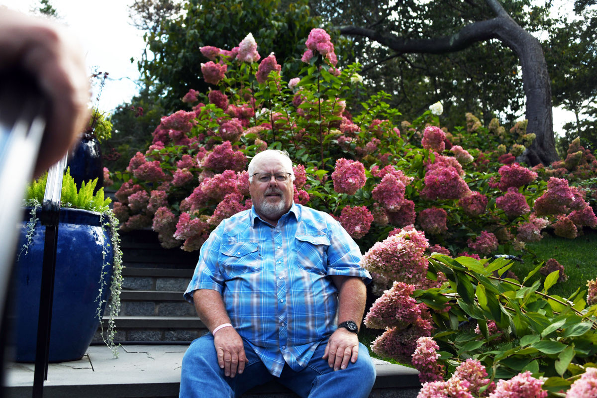 057 Karl Sherman among the hydrangeas at the Heritage Garden.jpg
